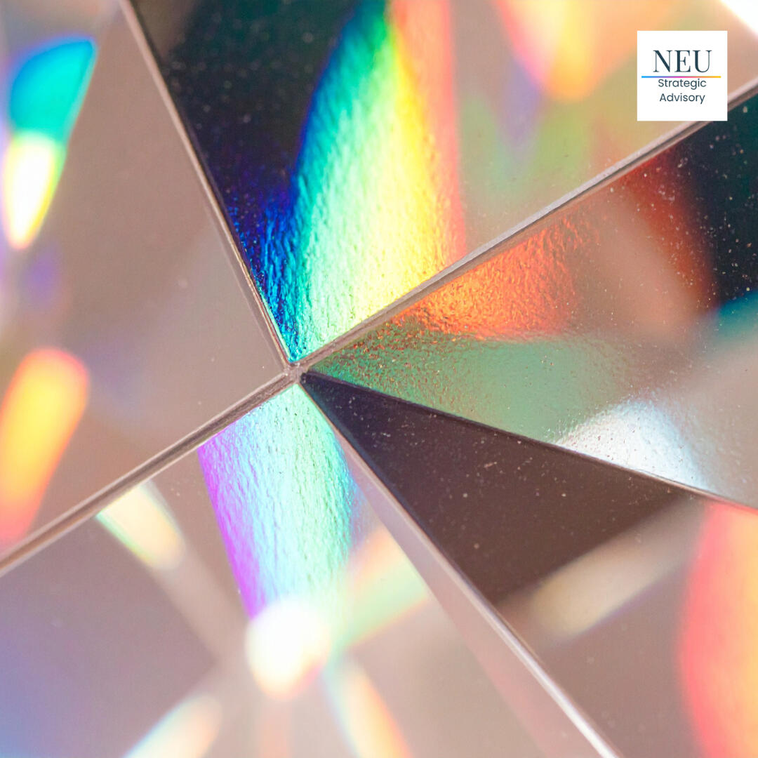 neu-strategic-advisory-healthcare-marketing-agency-los-angeles A close-up image of abstract glass reflecting rainbow light, with the logo for NEU Strategic Advisory, a healthcare and luxury brand marketing agency, in the top right corner.